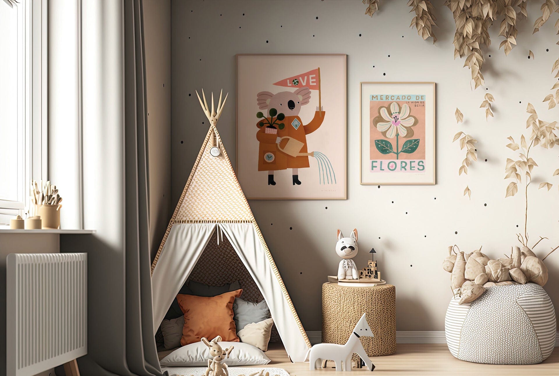 The corner of a childs playroom with a neutral teepee, leopard print side table, and grey dotted and striped pouffe, the wall wallpapered in a neutral colour with black dots spaced out across the wall irregularly. Toys are in the foreground. On the wall art 2 art prints in light wood frames. The larger being our love our planet koala art print and the smaller being our mercado de flores art print.