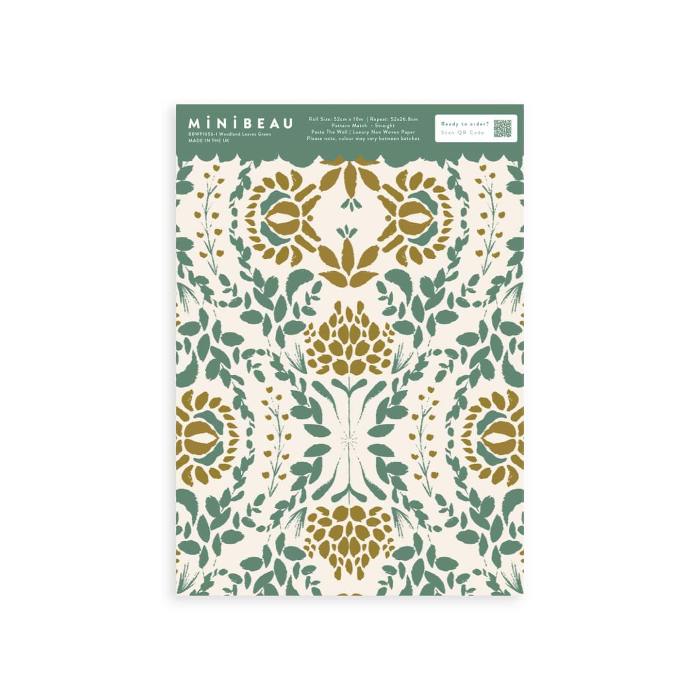 Wallpaper sample of green leaves with gold flowers and cream background.