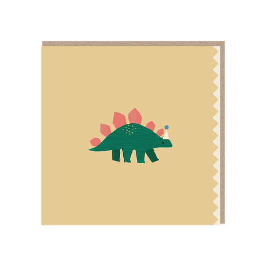 Square greetings card. Yellow background with a green stegosaurus with pink spines standing in the middle wearing an off white party hat with a blue pom pom. A zigzag edge in the same colour as the hat is on the right/open side. Comes with a brown kraft envelope