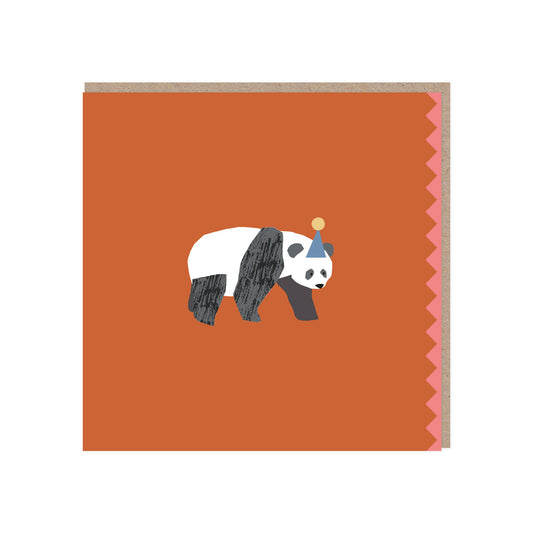 A red square card with a brown kraft envelope behind it. On the open edge is a pink zigzag pattern. In the centre of the card is a walking panda wearing a party hat with a pom pom on top.